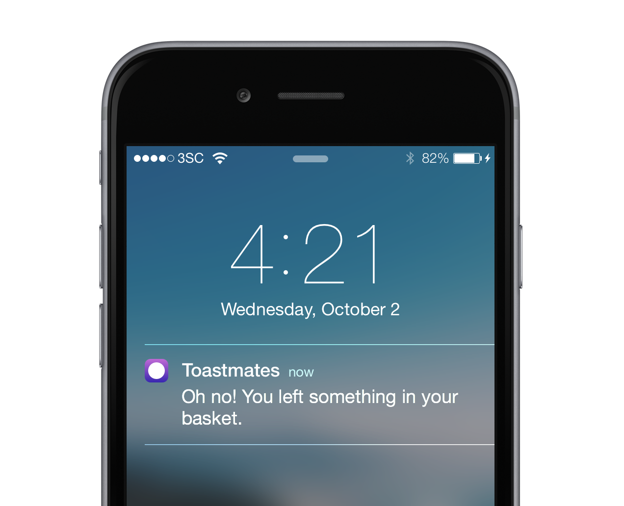 An Apple iPhone with a push notification from Toastmates that says Oh no! You left something in your basket.